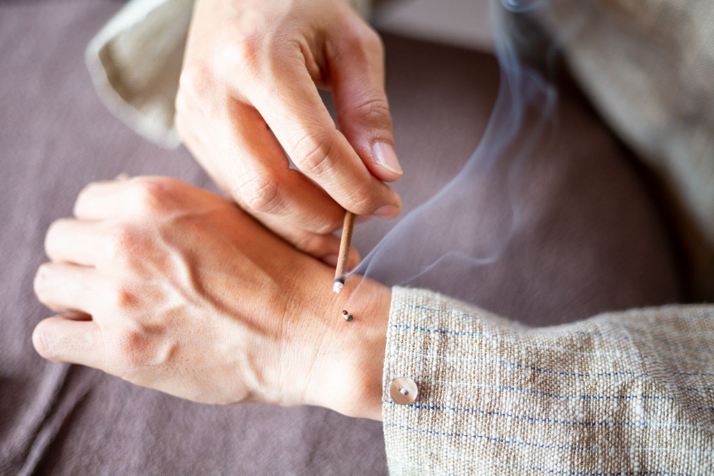 Moxibustion is a traditional Chinese medicine therapy which consists of burning dried mugwort on particular points on the body.